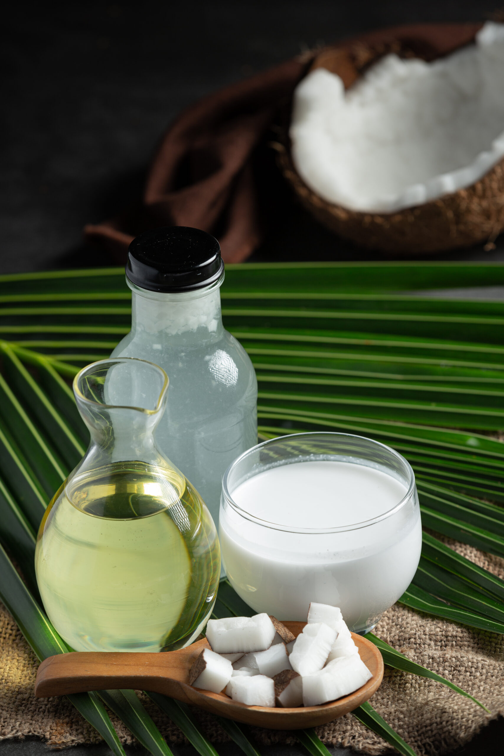 various types products from coconut put on floor Cold-Pressed Coconut Oil